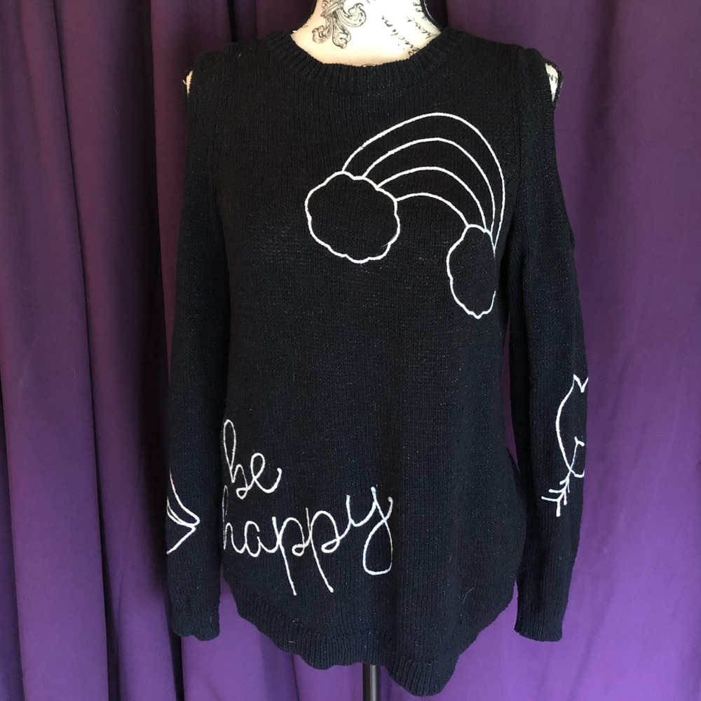 Justice Black sweater white stitch detail.